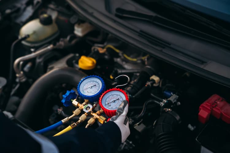 Air conditioning system service on a German vehicle at Bachmobile in Tomball, Texas