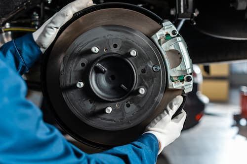 Brake rotor and caliper service on a German vehicle at Bachmobile in Tomball, Texas