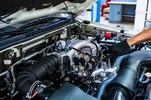 German engine bay opened up for repair work at Bachmobile in Tomball, Texas