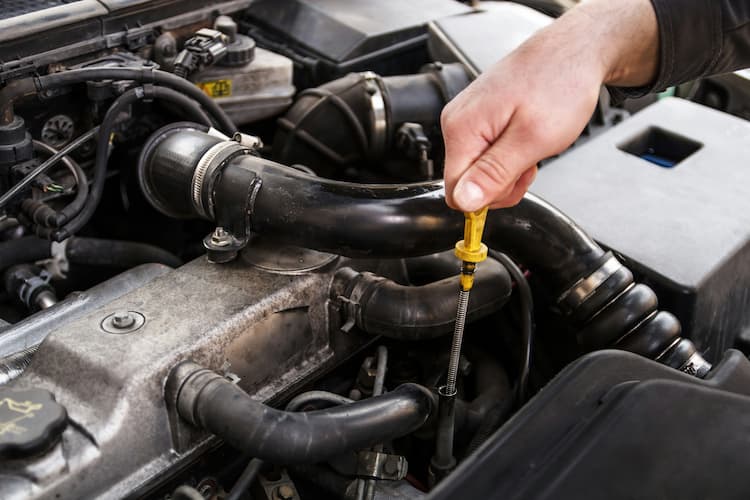 Oil and filter service being performed on a German vehicle at Bachmobile in Tomball, Texas