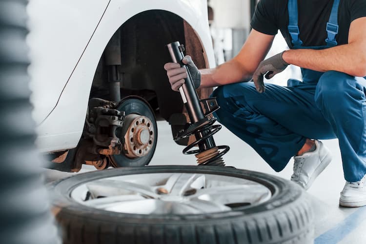 Suspension and steering components being serviced at Bachmobile in Tomball, Texas